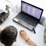 boy learning with digital tools
