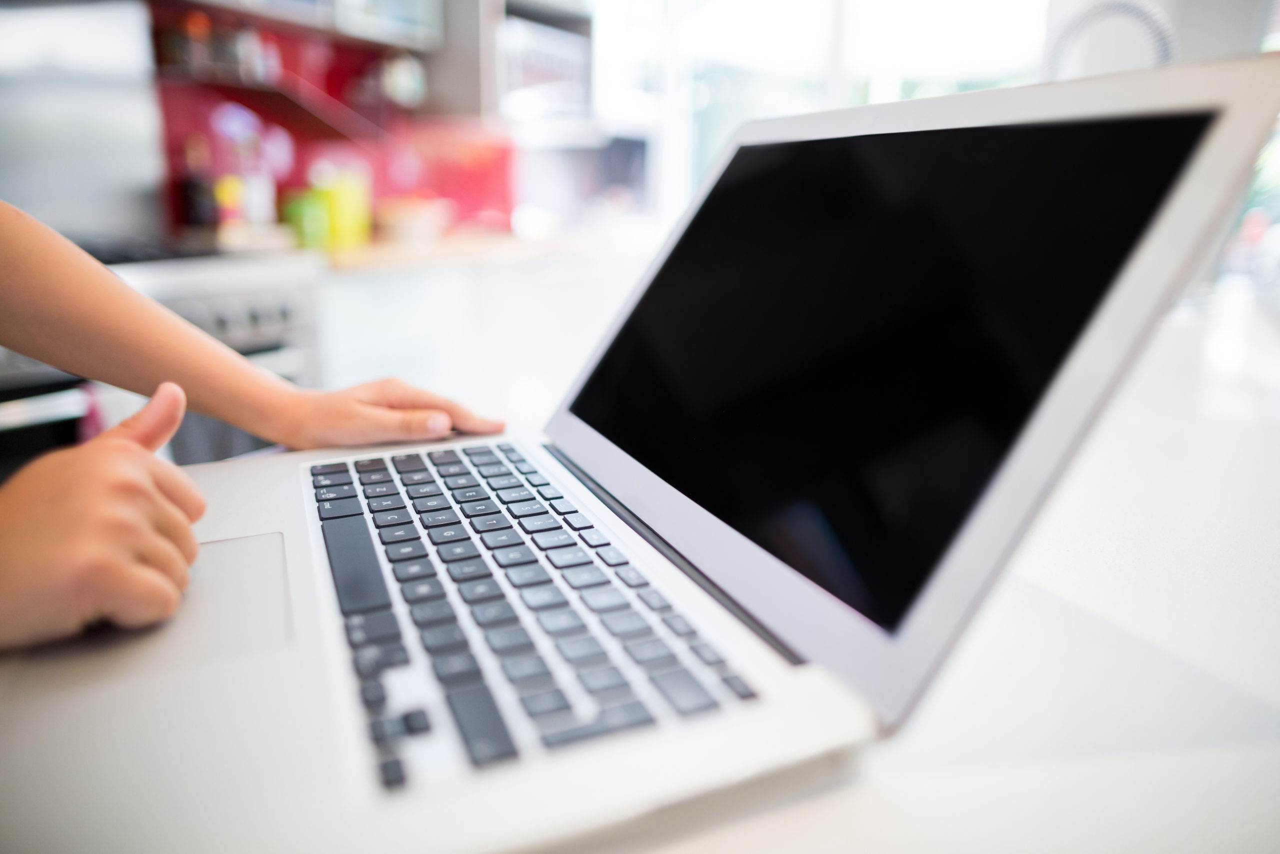 student using laptop for hybrid education