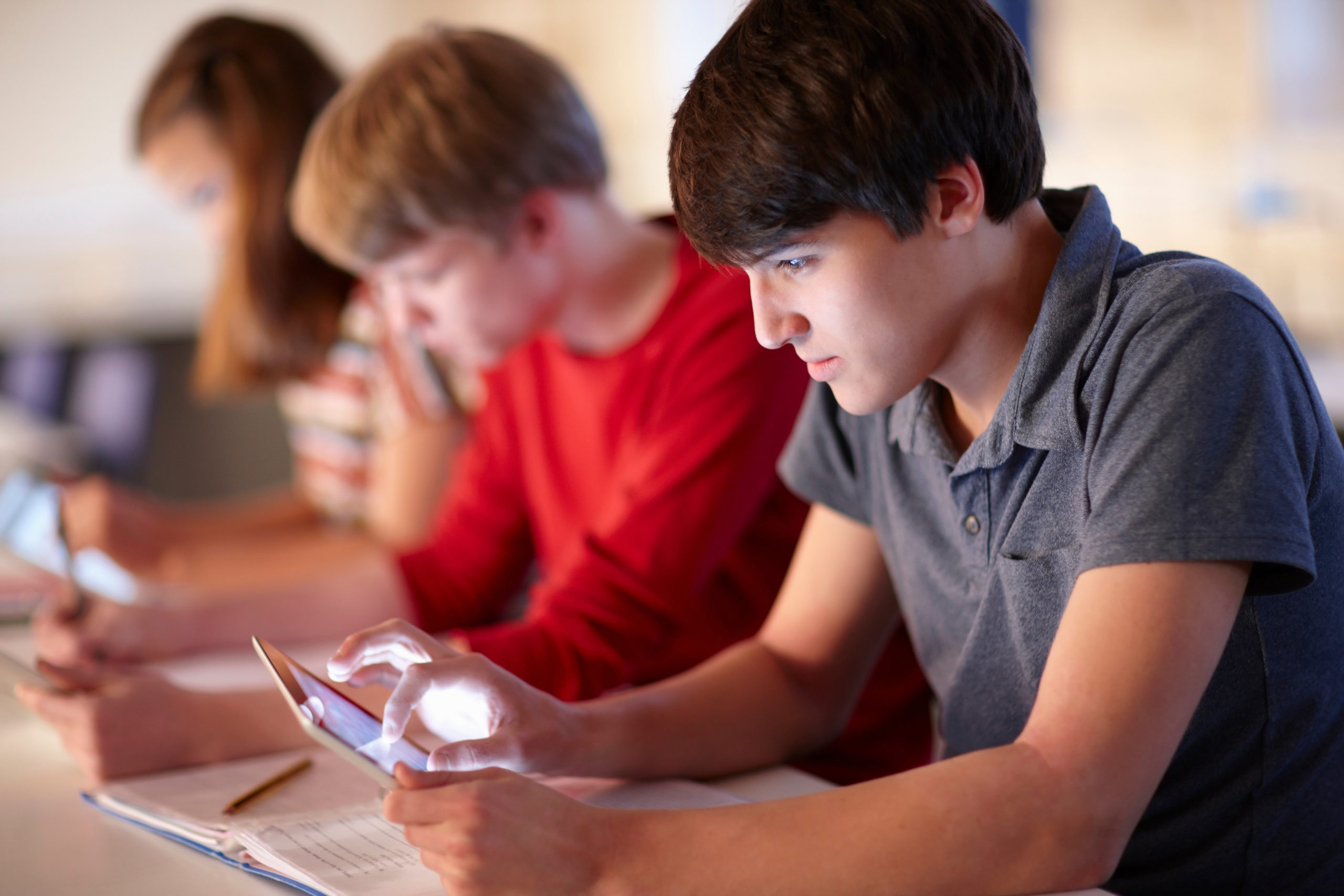 Students using tablet computers in class