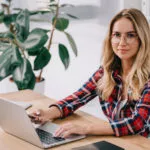 Featured image of teacher using laptop for student assessment
