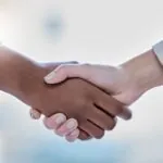 Business people, diversity and handshake in partnership, representing the partnership between TAO and Wiris MathType Math Editor